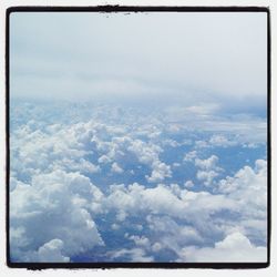 Aerial view of landscape against cloudy sky