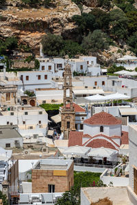 View at the city of lindos on greek island rhodes with white houses and mountain in the background