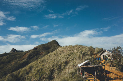 Scenic view of landscape against cloudy sky