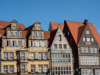 Low angle view of buildings against clear sky