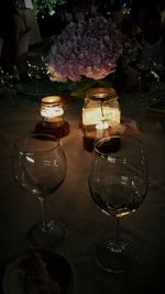 Close-up of wine glasses on table