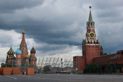 Tower of building against cloudy sky