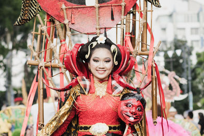Portrait of smiling girl in traditional clothing