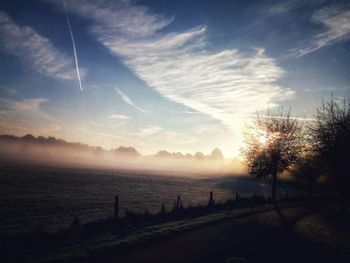 Scenic view of field against sky during sunset