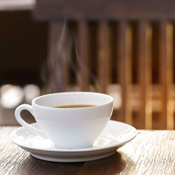 Close-up of coffee cup on table
