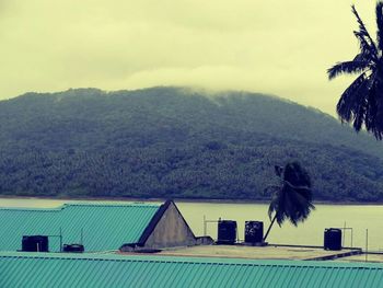 View of a house on mountain against sky