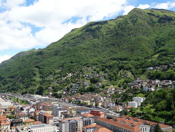 High angle view of townscape and mountain against sky