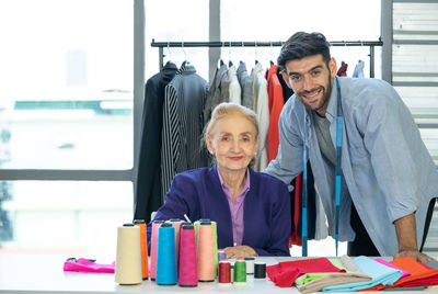 Portrait of friends working on table