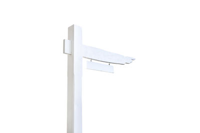 Low angle view of cross against white background