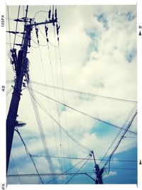 Low angle view of electricity pylon against cloudy sky