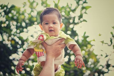 Portrait of cute boy playing outdoors