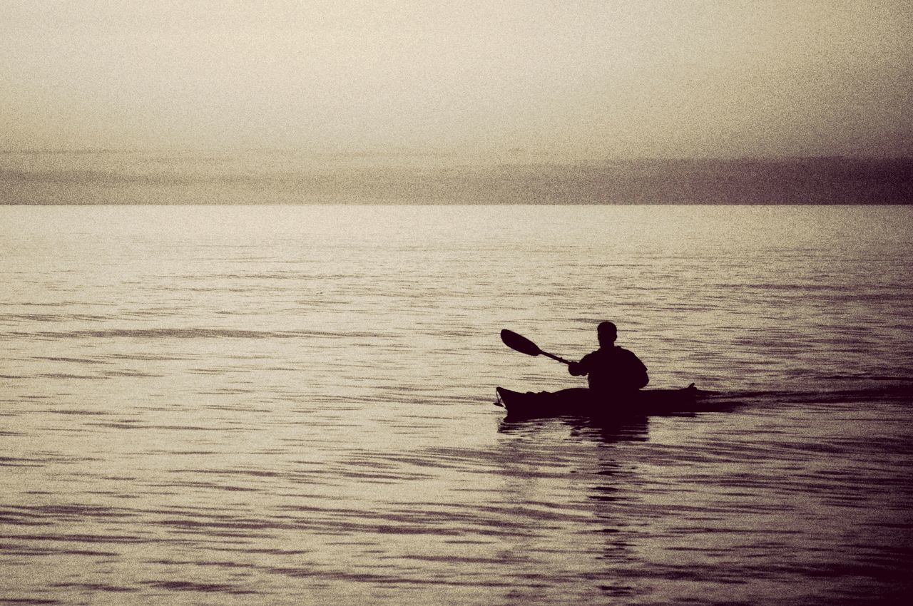 water, nautical vessel, boat, silhouette, men, sea, transportation, waterfront, leisure activity, lifestyles, mode of transport, rippled, tranquil scene, tranquility, nature, beauty in nature, scenics