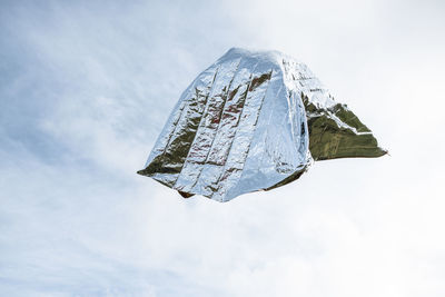 Low angle view of umbrella against sky