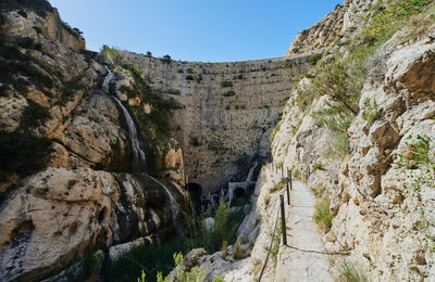 Scenic view of cliff against sky