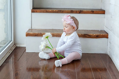 Portrait of cute girl playing with teddy bear