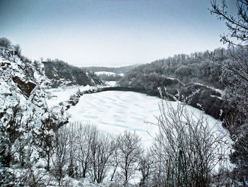 Scenic view of frozen lake against clear sky