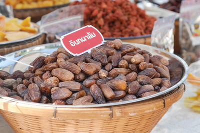 Fruits in basket for sale at market stall