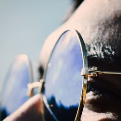 Close-up of hand against clear sky