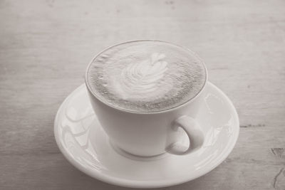 Close-up of coffee cup on table