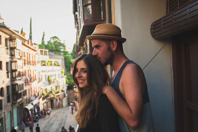Young couple standing in city