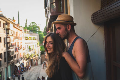 Young couple standing in balcony