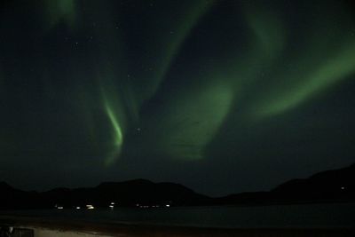 Scenic view of silhouette mountain against sky at night