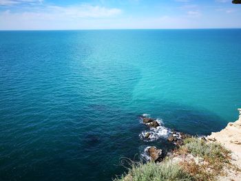 High angle view of sea against blue sky