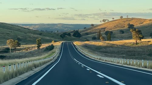 Empty road against sky