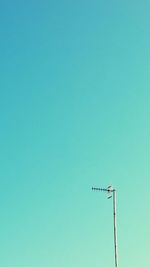 Low angle view of street light against clear blue sky