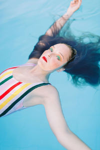 Teen girl having fun in the swimming pool