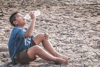 Boy sitting on beach