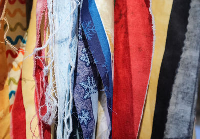 Detailed close up view on samples of cloth and fabrics in different colors found at a fabrics market