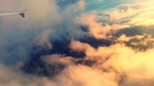 Low angle view of cloudy sky at sunset