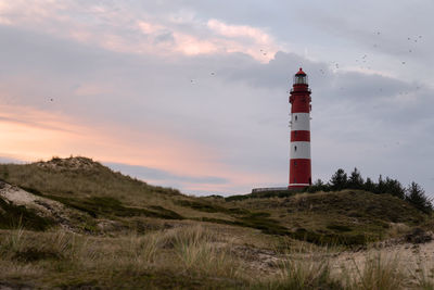 Panoramic image of the wittduen lighthouse at sunset, amrum, germany