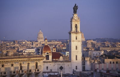 Church in city against clear sky