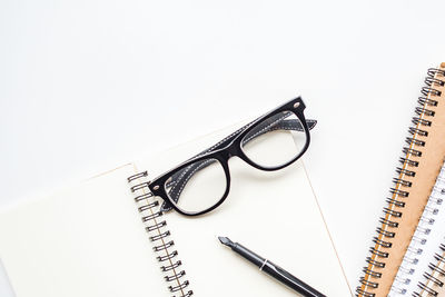 Close-up of eyeglasses against white background