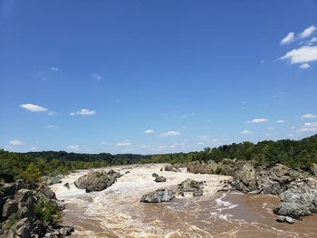 Scenic view of great falls against sky