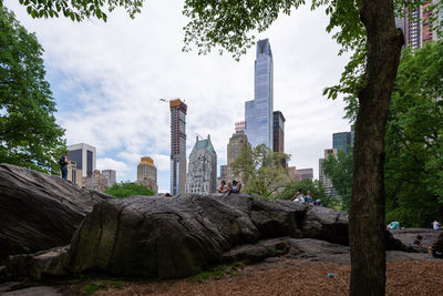 Panoramic view of buildings and trees against sky