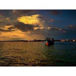 Scenic view of calm sea at sunset