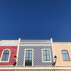 Low angle view of building against blue sky