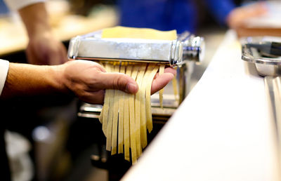 Close-up of hands working on table