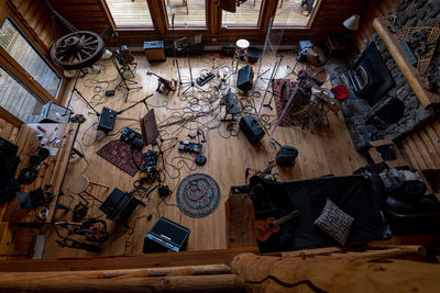 Looking down on a cabin filed with musical equipment 