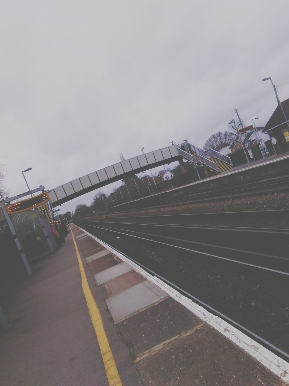 transportation, architecture, built structure, sky, building exterior, road, city, street, car, mode of transport, connection, the way forward, outdoors, bridge - man made structure, clear sky, travel, copy space, railroad track, road marking, no people