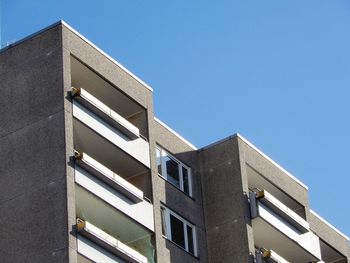 Low angle view of building against clear blue sky