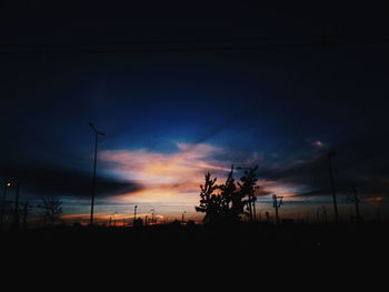 Silhouette landscape against scenic sky