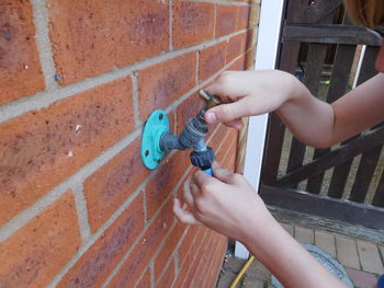 High angle view of man hand on wall
