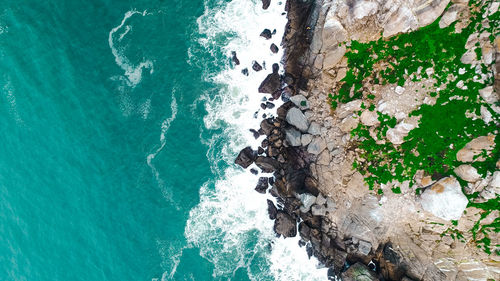 High angle view of rock formation on sea