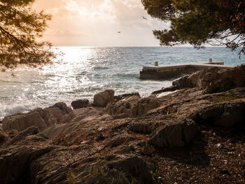 Scenic view of sea against sky at sunset