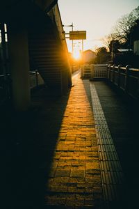 Footpath amidst buildings in city