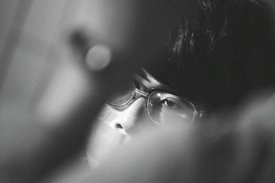 Close-up of person wearing eyeglasses